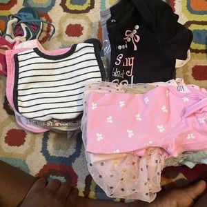 14 bibs and 14 6-9mths onesies